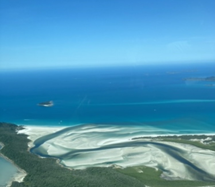 sand swirling around sea