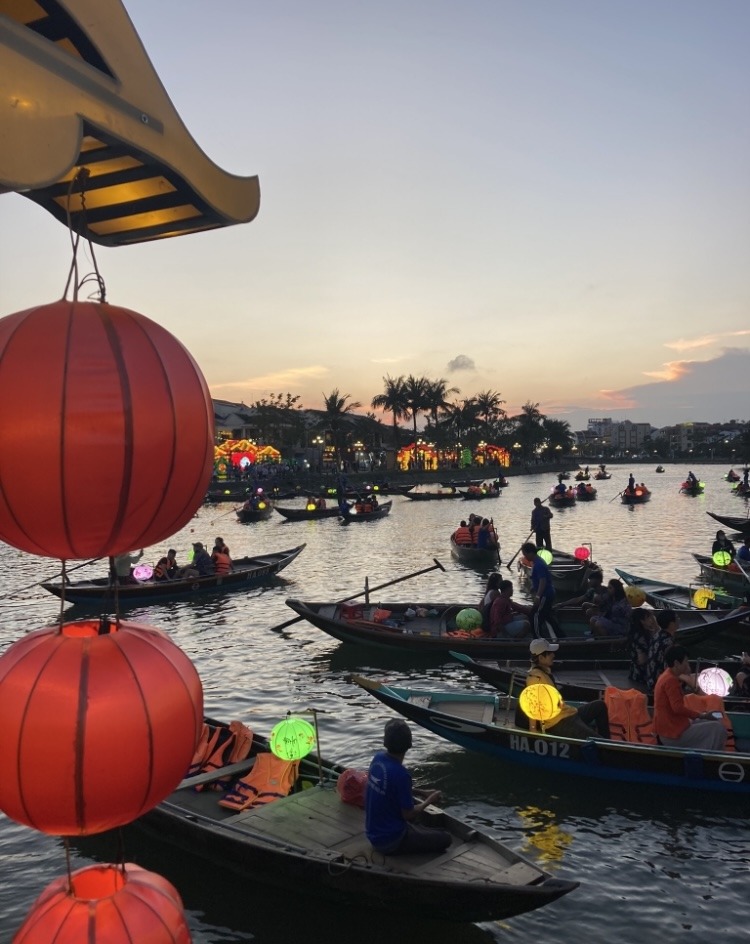 Hoi An ancient town river with lanterns at sunset