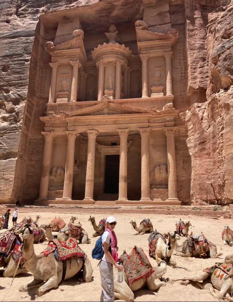 ancient city of Petra, treasury building with camels in foreground